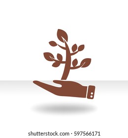 Flat icon. The plant is in the palm of a person. In human hands the fate of the plant world.