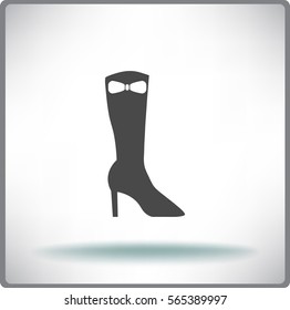 Icono plano. Botas de las mujeres