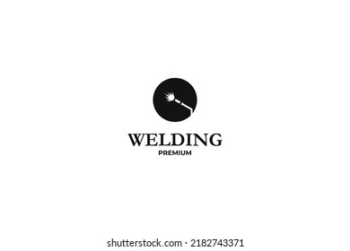 Flat illustration welding torch logo design. Welder tool with spark vector design. Welding work logotype