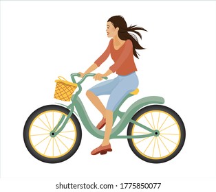 Flat illustration of a young girl with flying hair in casual clothes taking a bike ride with a basket. Isolated on a white background in vector.
