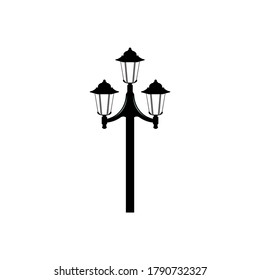 Flat image of latern. Street lamp with three shades on a pole. Street light symbol. 