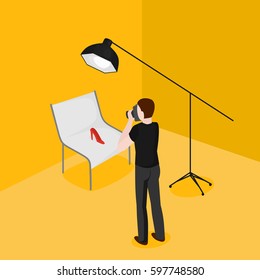 Flat isometric man taking pictures of shoes. Advertising photographer and shooting table in photostudio vector illustration