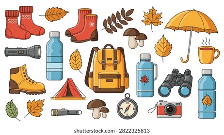 Flat lay of autumn camping and hiking equipment with yellow backpack boots compass thermos and dry leaves.