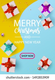 Flat Lay Christmas and Happy New Year or Party Background with Gift boxs, confetti, Present box border on yellow light blue pastel backdrop.