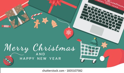 Flat lay of Merry Christmas and happy new year concept with a laptop, presents, cookies, candy, Santa hat, and shopping cart, vector illustration