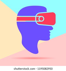 flat lay modern minimal man head in virtual reality glasses icon with shadow on pastel colored blue and pink background