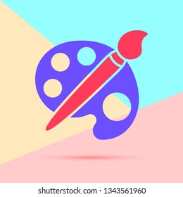 flat lay modern pink art paint brush with palette icon with shadow on pastel colored blue and pink background