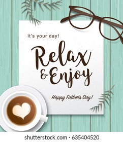 Flat lay style father`s day greeting card with cup of coffee and glasses on wooden table.