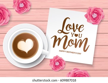 Flat lay style mother's day greeting card with coffee cup, flowers and white note paper on wooden table.