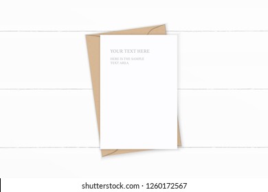 Flat lay top view elegant white composition letter kraft paper envelope on wooden background.