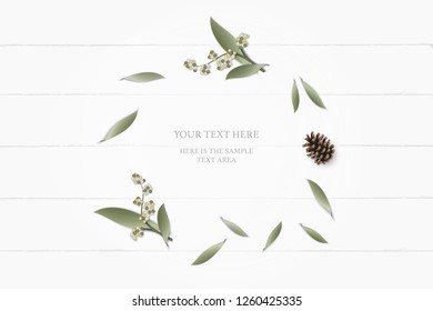 Flat lay top view elegant white composition paper botanic garden plant leaf flower pine cone on wooden background.