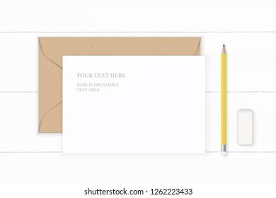 Flat lay top view elegant white composition letter kraft paper envelope yellow pencil and eraser on wooden background.