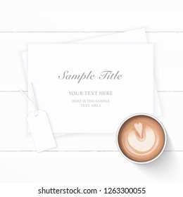Flat lay top view elegant white composition paper coffee and tag on wooden background.