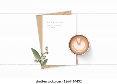 Flat lay top view elegant white composition letter kraft paper envelope flower leaf and coffee on wooden background.