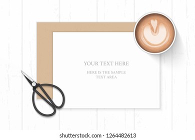 Flat lay top view elegant white composition paper kraft envelope coffee and vintage metal scissors on wooden background.