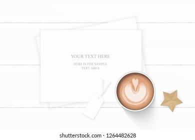 Flat lay top view elegant white composition paper coffee tag and star shape craft object on wooden background.