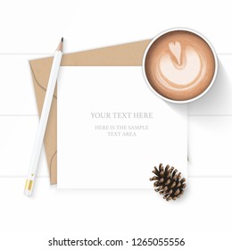 Flat lay top view elegant white composition letter kraft paper envelope pencil pine cone and coffee on wooden background.