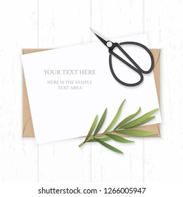 Flat lay top view elegant white composition paper kraft envelope tarragon leaf and vintage metal scissors on wooden background.