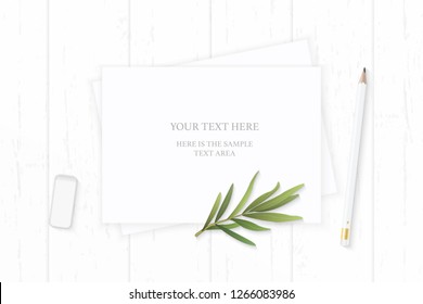 Flat lay top view elegant white composition paper pencil tarragon leaf and eraser on wooden background.