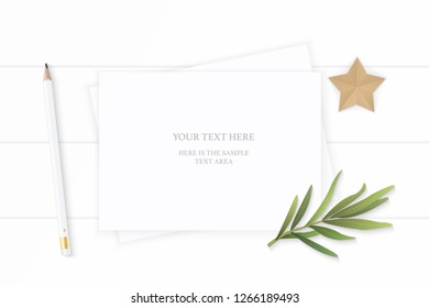 Flat lay top view elegant white composition paper pencil eraser tarragon leaf and star shape craft on wooden background.