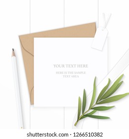 Flat lay top view elegant white composition letter kraft paper envelope pencil tag and tarragon leaf on wooden background.