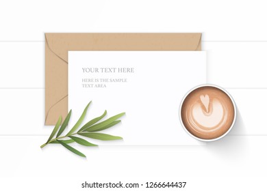 Flat lay top view elegant white composition letter kraft paper envelope coffee and tarragon leaf on wooden background.