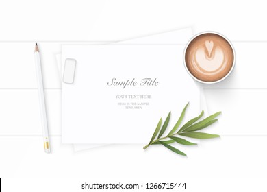 Flat lay top view elegant white composition paper coffee pencil tarragon leaf and eraser on wooden background.
