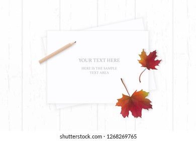 Flat lay top view elegant white composition paper pencil autumn red maple leaf on wooden background.