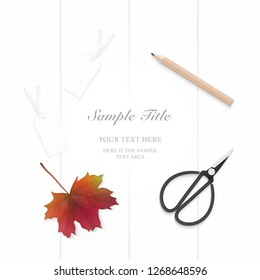 Flat lay top view elegant composition paper pencil autumn maple leaf tags and vintage metal scissors on wooden background.