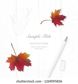 Flat lay top view elegant composition paper autumn maple leaf tags and pencil eraser on wooden background.