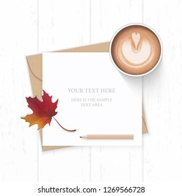 Flat lay top view elegant white composition letter kraft paper envelope autumn maple leaf pencil and coffee on wooden background.