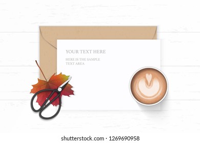 Flat lay top view elegant white composition letter paper kraft envelope coffee autumn maple leaf and vintage metal scissors on wooden background.