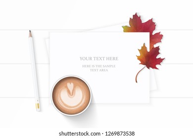 Flat lay top view elegant white composition paper pencil coffe and autumn maple leaf on wooden background.