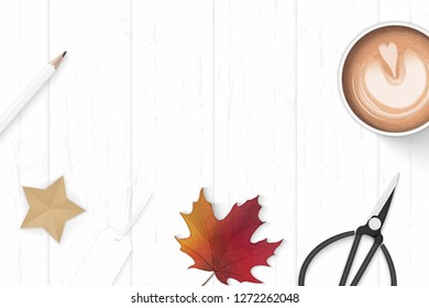 Flat lay top view elegant white composition paper coffee pencil star craft autumn maple leaf tag and metal scissors on wooden background.