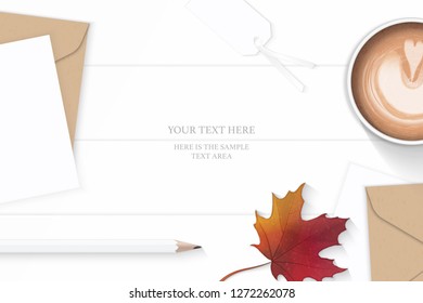 Flat lay top view elegant white composition letter kraft paper envelope leaf pencil autumn maple leaf tag and coffee on wooden background.