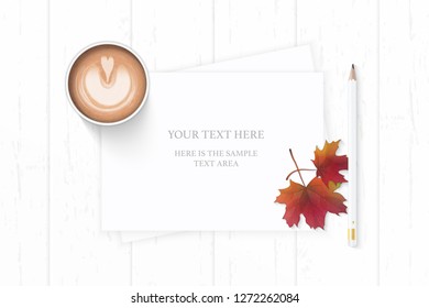 Flat lay top view elegant white composition paper autumn maple leaf pencil and coffee on wooden background.