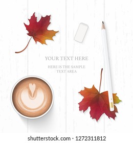 Flat lay top view elegant white composition paper pencil eraser coffee and autumn maple leaf on wooden background