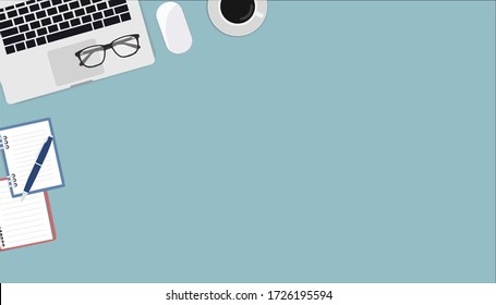 Flat lay, top view office table. Workspace with blank notebook, laptop, pen and coffee cup on blue background.