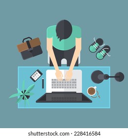 Flat modern design of workspace with man working on laptop computer