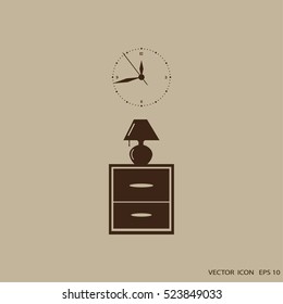 Flat nightstand with clock and lamp. Living room.Bedside table.
