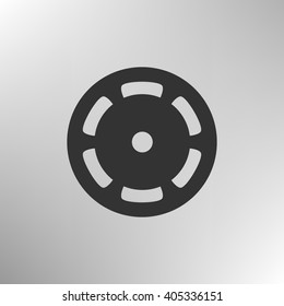 Flat paper cut style icon of old tape spool. Vector illustration