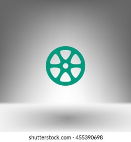 Flat paper cut style icon of old tape spool. Vector illustration