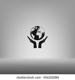 Flat paper cut style icon of two hands holding Earth. Vector illustration