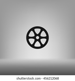 Flat paper cut style icon of old tape spool. Vector illustration