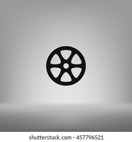 Flat paper cut style icon of old tape spool. Vector illustration