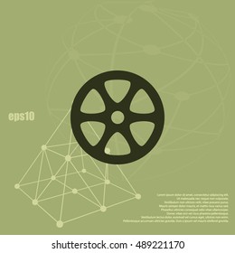 Flat paper cut style icon of old tape spool. Vector illustration