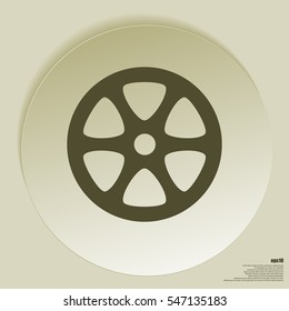 Flat paper cut style icon of old tape spool. Vector illustration
