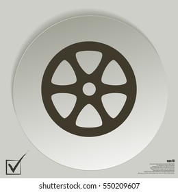 Flat paper cut style icon of old tape spool. Vector illustration