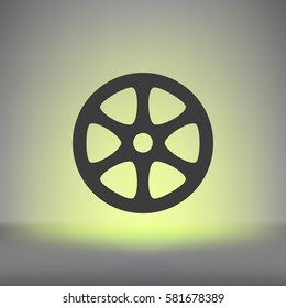 Flat paper cut style icon of old tape spool. Vector illustration
