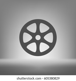Flat paper cut style icon of old tape spool. Vector illustration